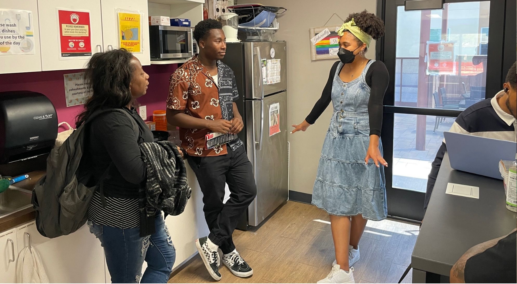 Natalie King-Shaw (right) hosting an SDSU prospective student and their mother at the Black Resource Center.