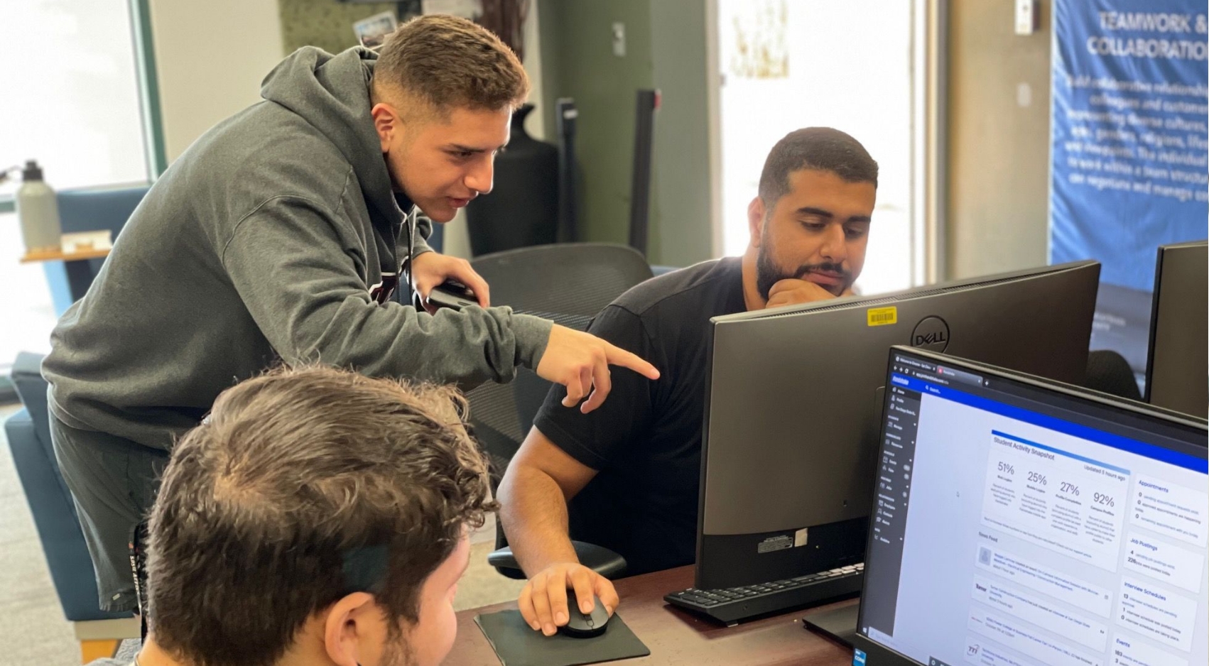 (From left) Luis Salas, Gabriel Mendez and Ali Al-Bahar at SDSU's Career Resource Room.