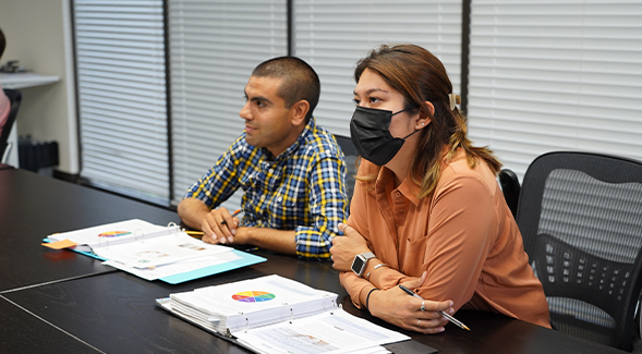 SDSU graduate student Yasmeen Atempa (right) and a neurodiverse participant attend a SUCCESS curriculum session on vocational soft skills, a program developed by researcher Mary Baker-Ericzn.