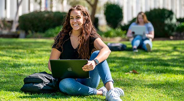 A grant from Bank of America and the San Diego Foundation supports students preparing for careers in health care. Pictured above: a student with laptop computer on the SDSU campus.