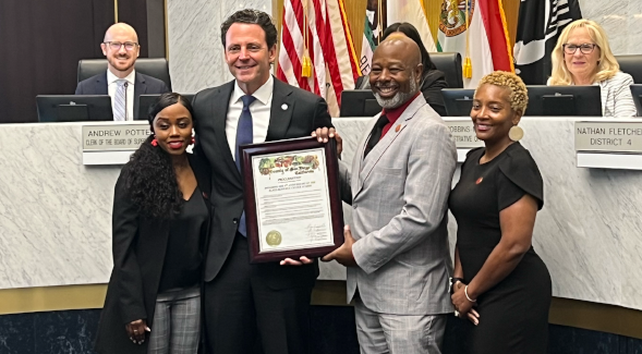 Rachael Stewart, Brandon Gamble and Tonika Green receive a proclamation plaque from San Diego County Supervisor Nathan Fletcher recognizing SDSU's BRC. (Robson Winter, SDSU Associated Students)