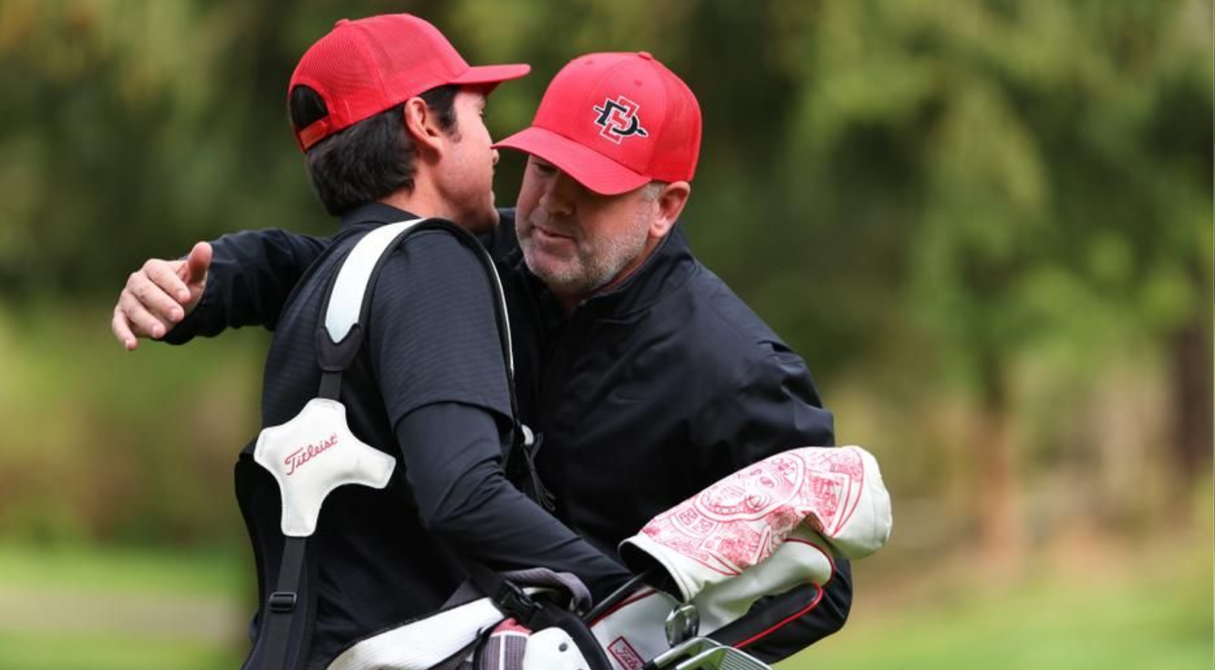 Ryan Donovan (right) is in his 20th season leading SDSU men's golf.