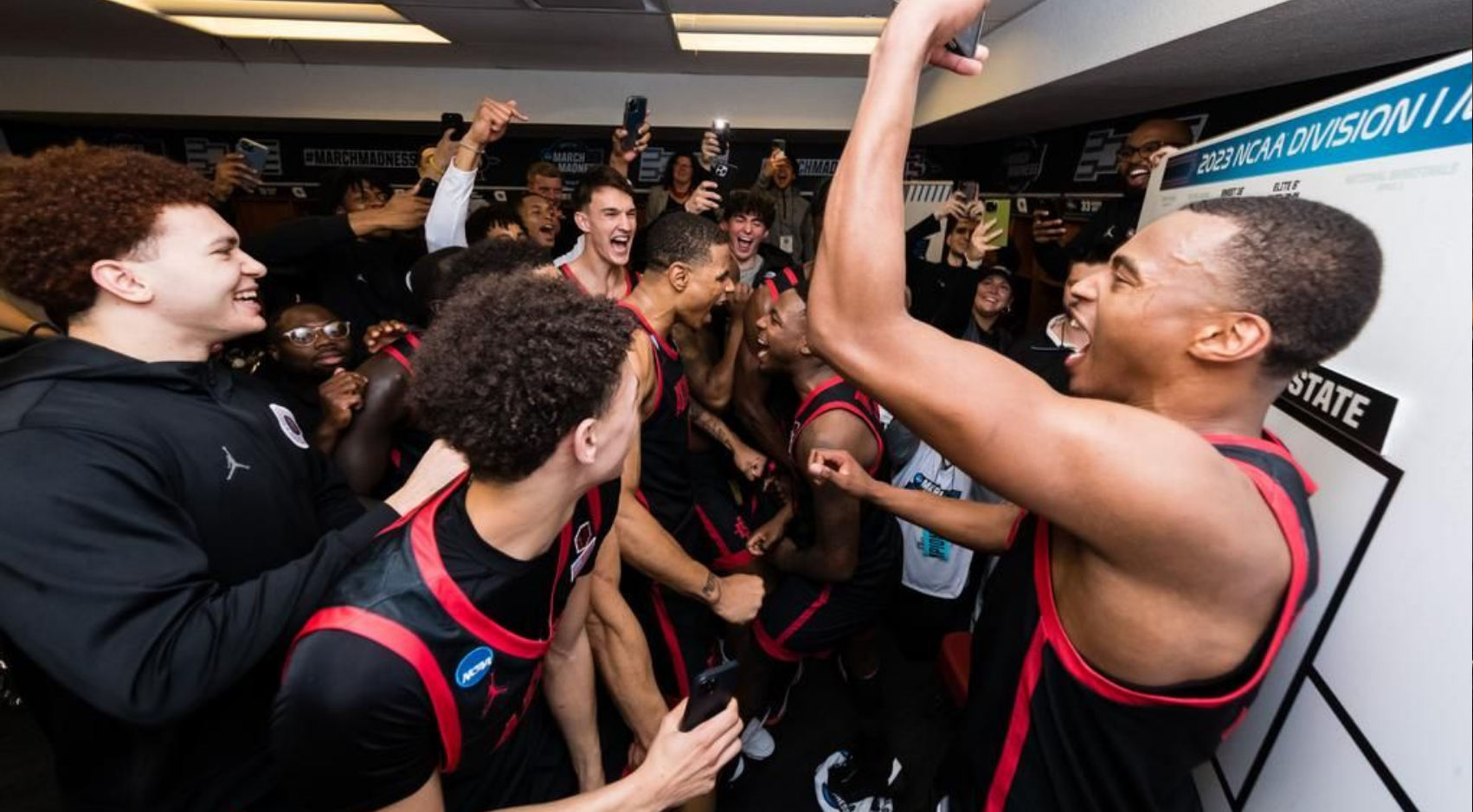 The SDSU Aztecs men's basketball team celebrates their 71-64 victory over number one overall seed Alabama Crimson Tide in the NCAA Sweet 16 round, Friday, March 24, 2023. (SDSU)
