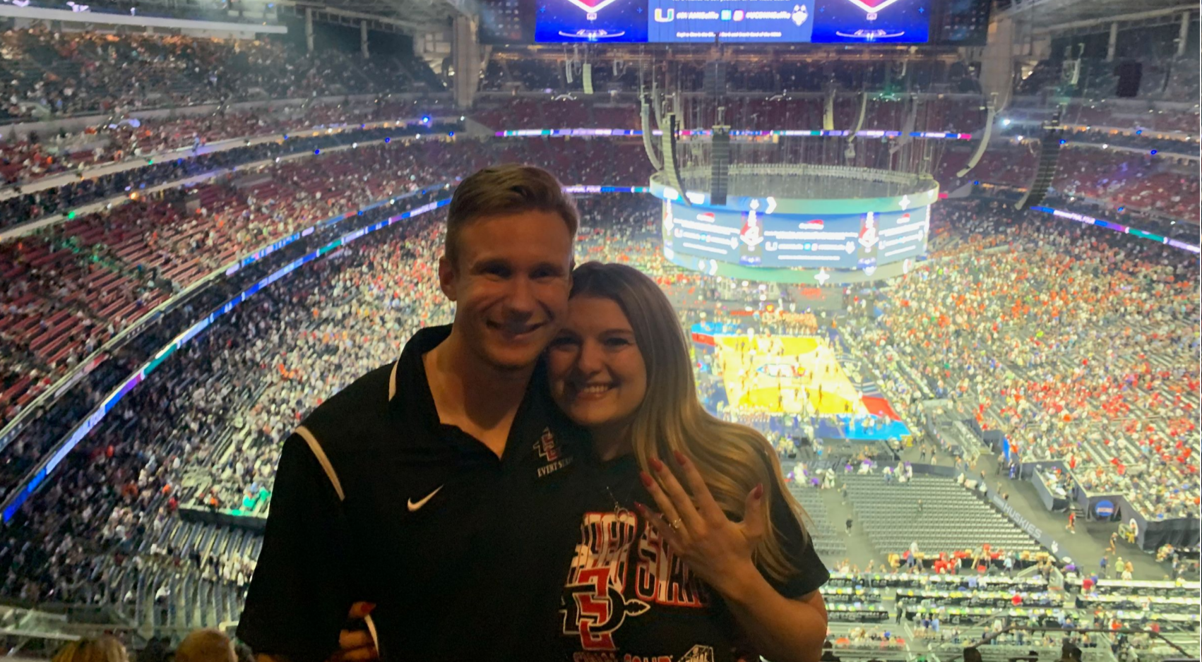 Cole Larson (left) proposed to Megan Varra right after Lamont Butler's buzzer-beating shot. (Photo courtesy Megan Varra)