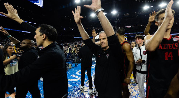 SDSU coach Brian Dutcher (center) after Aztecs' game against UConn at NRG Stadium in Houston, Texas, Monday, April 3, 2023. (SDSU)