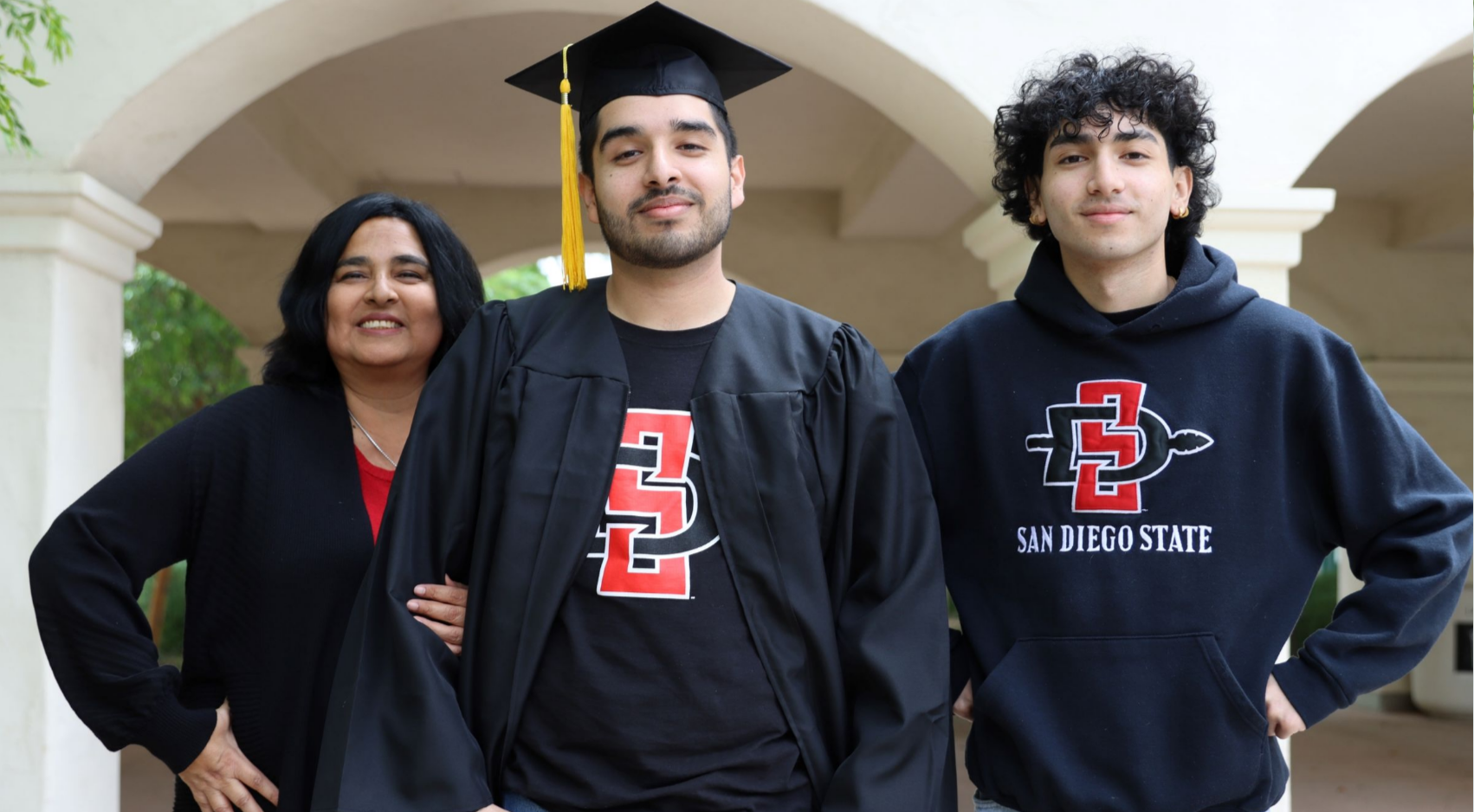 Janet (left), Danny, and Miguel Tisnado stand outside of the Engineering building. (Melinda Sevilla/SDSU)