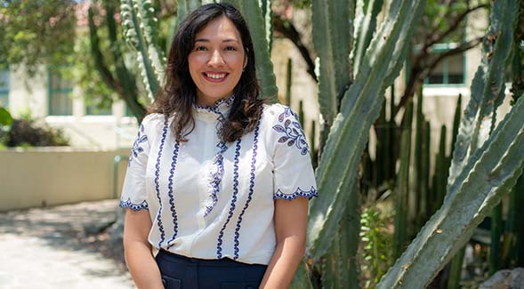 Assistant professor Ana Dueas, selected for the Institute of Education Sciences (IES) Early Career Award, posed in SDSU's Mediterranean Garden. (Photo:  Ian Ordonio)