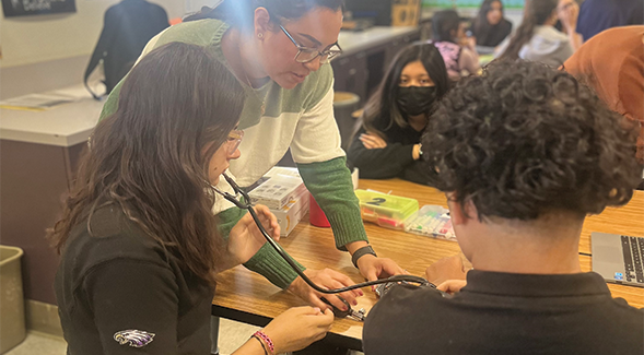 SDSU Imperial Valley nursing students teach students to take vital signs, such as blood pressure, which provide insight into essential skills needed for nursing. (SDSU Imperial Valley)