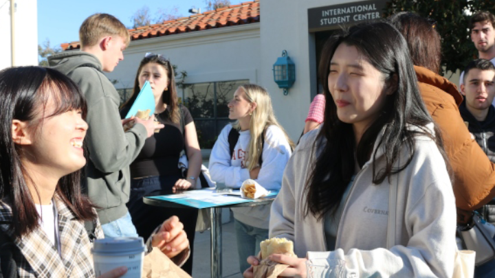 The spring semester cohort of international students gather for an orientation breakfast at the International Student Center (ISC)