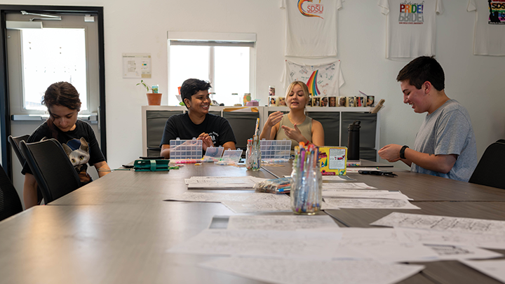 Staff and students gather inside The Pride Center. The center will be hosting an open house in celebration of its 10th anniversary, January 31 from 3-5:30 p.m.