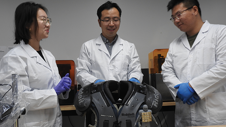 From left: SDSU doctoral student Qingqing He, Assistant Professor of mechanical engineering Yang Yang and USC graduate student Yushun Zeng in the laboratory. (Taylor Slane/SDSU)