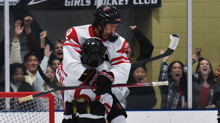 SDSU Aztecs' Marcus Kim and Braden Mayer (61) celebrate a goal during the team's season opening home match against Loyola Marymount University, September 15, 2023 at KROC Ice Center, San Diego, Calif. (Megan Ellis/SDSU Hockey)