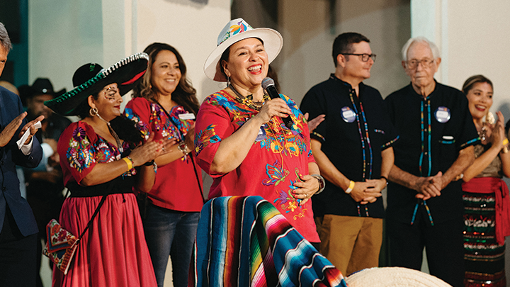 Guillermina Gina Núñez-Mchiri (center), dean of SDSU Imperial Valley, speaks during the “Mariachi sin Fronteras” festival, a community event with the Calexico Rotary Club and the Consulate of Mexico, Sept. 16, 2023. (SDSU)