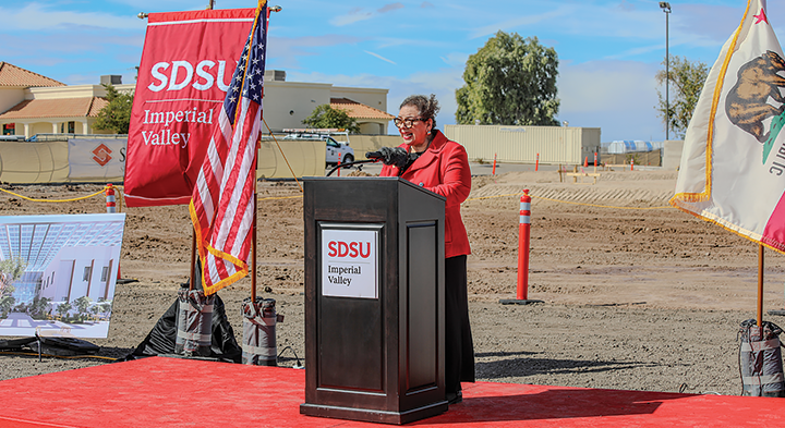 Woman speaking at a podium