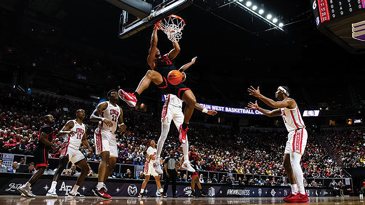 SDSU men's basketball player Jaedon LeDee dunks over a UNLV defender during their quaterfinals match. (SDSU)