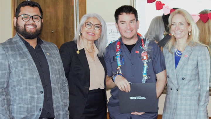 Instructor Elias Oceguera, SDSU Associate Vice President Dr. Cristina Alfaro, Hilton Harbor Island maintenance engineer Ivan Castro and Bartell Hotels Vice President Lydia Bartell at the English as a Second Language certification ceremony Feb. 14.