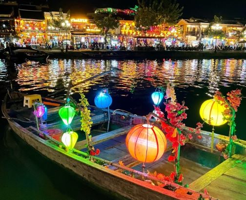 Lanterns illuminate a riverboat in Vietnam.