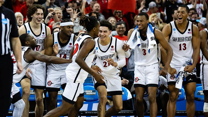 SDSU huddles with coach Brian Dutcher during their match against UAB in the NCAA tournament.