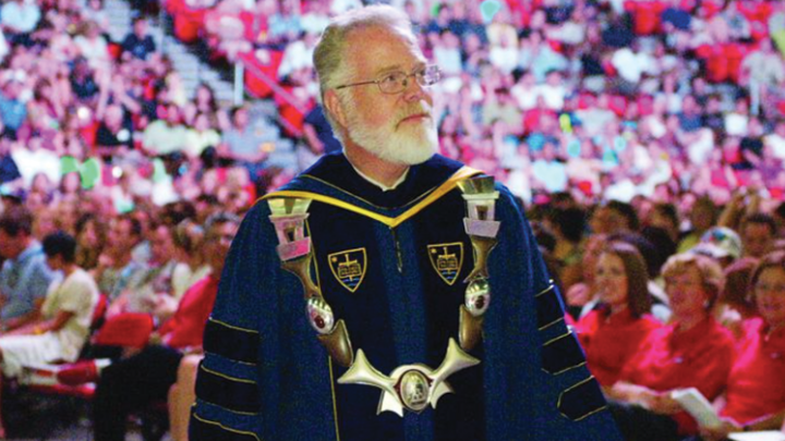 Former SDSU President Stephen Weber looks into the audience during a commencement ceremony.