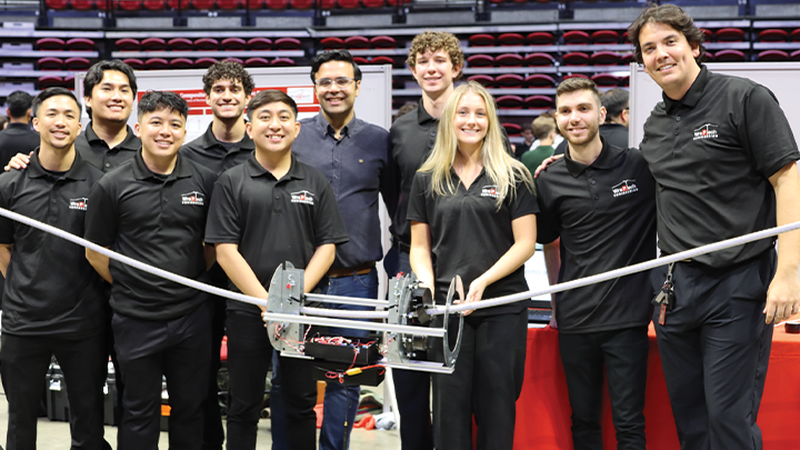Team Wrap Tech pose for a photo with mentor and Assistant Professor of Electrical and Computer Engineering Saeed Manshadi.