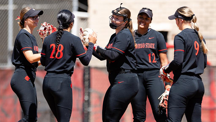 SDSU softball players celebrate on the field.