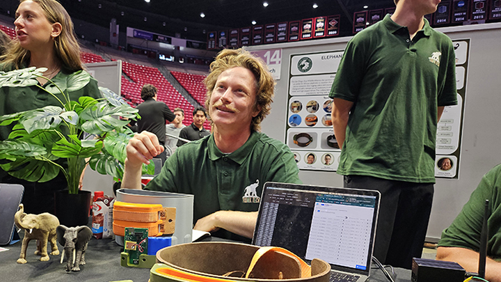 Computer engineering student Jacob Flaxman answers questions about the Trunk Tech elephant tracking device at Senior Design Day. (Susanne Clara Bard/SDSU)