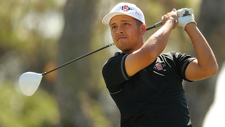 Dressed in SDSU Aztecs attire, former student-athlete Xander Schauffele strikes a ball during golf play.