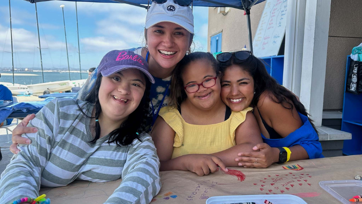 SDSU staff pose for a photograph with students at Camp Able.