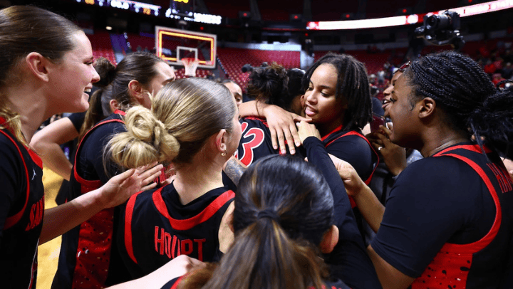 SDSU senior guard Jazlen Green embraces Kim Villalobos after a triple-overtime win over Wyoming in the Mountain West title game. (Credit: NCAA Photos)