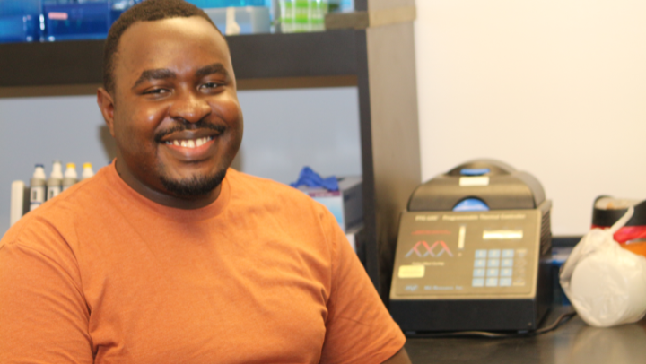 Trevor Mugoya, a bioinformatics master’s student from Uganda, probes plant genomics in SDSU’s Sethuraman Lab. (Mike Freeman)