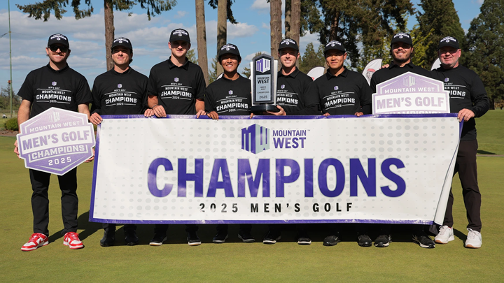 The SDSU Men's Golf team pose with their conference trophy and banners.