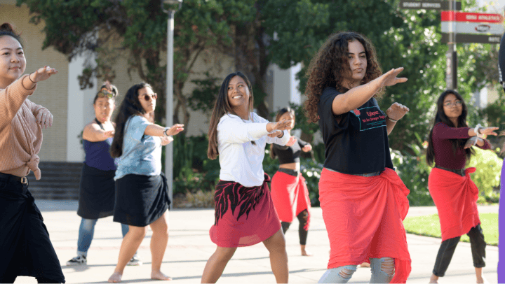 Students dance the hula during spring fling presentation at SDSU. 