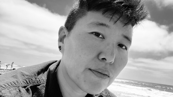 A black and white headshot of AJ Kim.