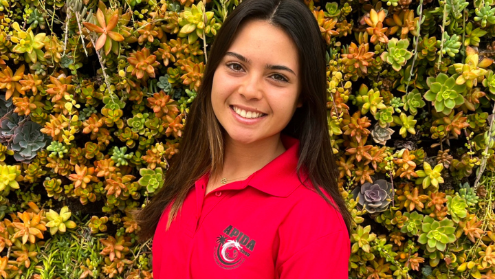 Krissa Jackson photographed in her SDSU APIDA polo shirt on campus.