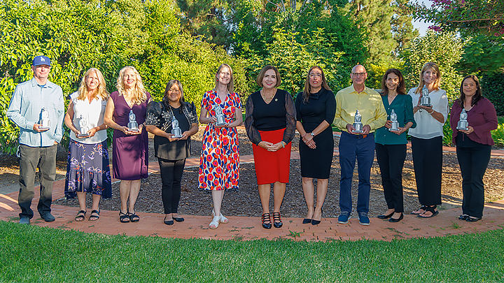 From left: Patrick Flanigan, Michelle Lenoue, Julie Pickrel, Joanne Rullan, Kimberly Kennelly, SDSU President Adela de la Torre, Cristina Sanchez, Rick Gulizia, Teresa Couri, Naedean Anderson and Miranda Elliget. (Scott Hargrove/SDSU)
