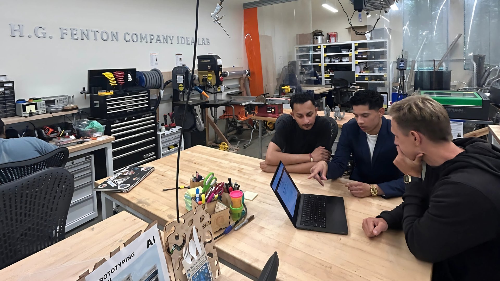 2 people looking down on their desks