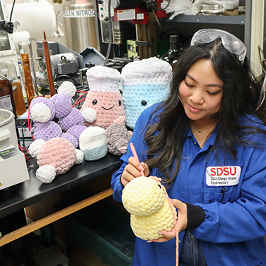 girl holding a ball of yarn
