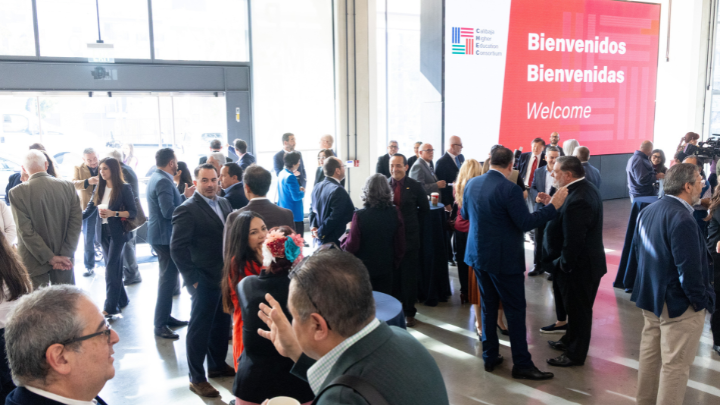 a crowd of people in a building all talking amongst themselves