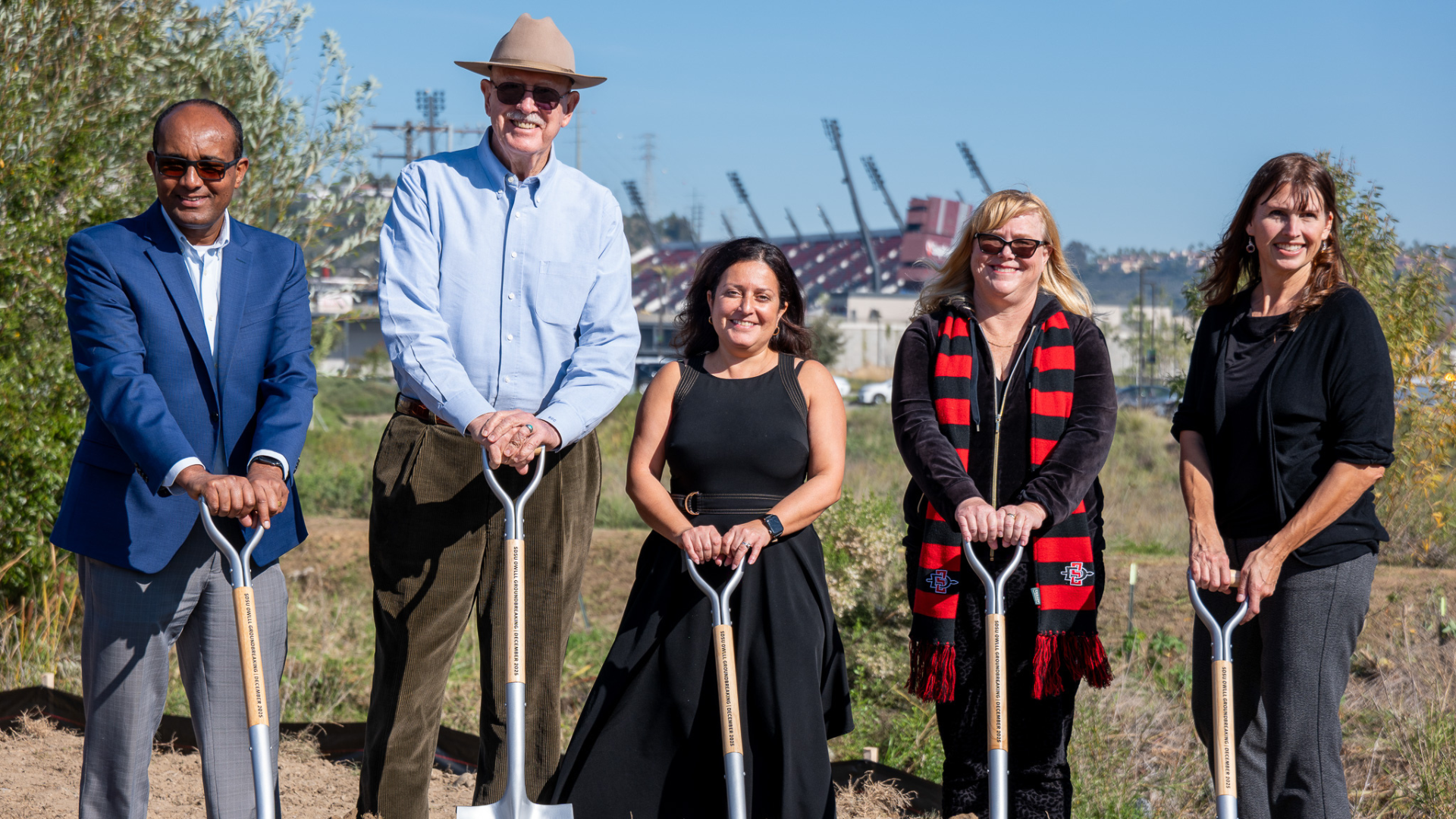 image of 5 people digging with shovels