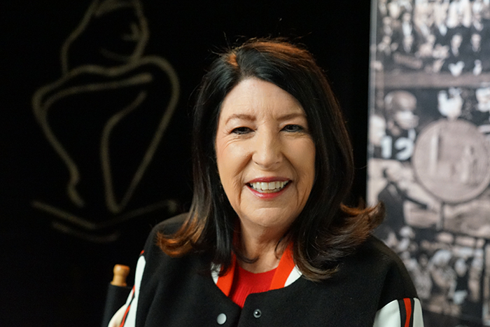 woman in front of textured background