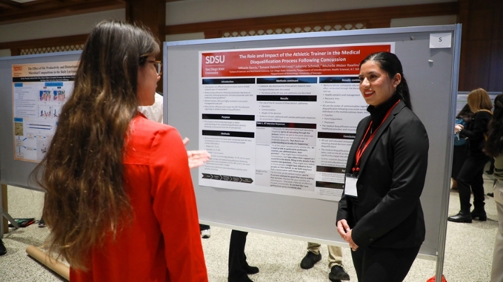 student presenting research