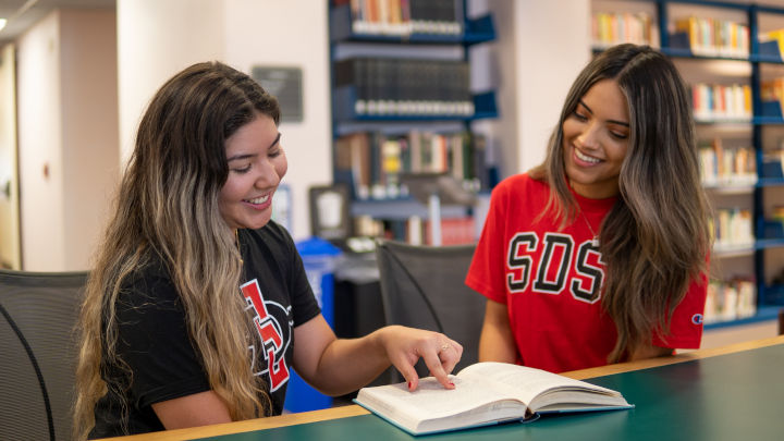 Two SDSU students studying